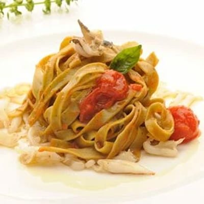 Basil Tagliatelle on a Cherry Tomato and Baby Squid Sauce
